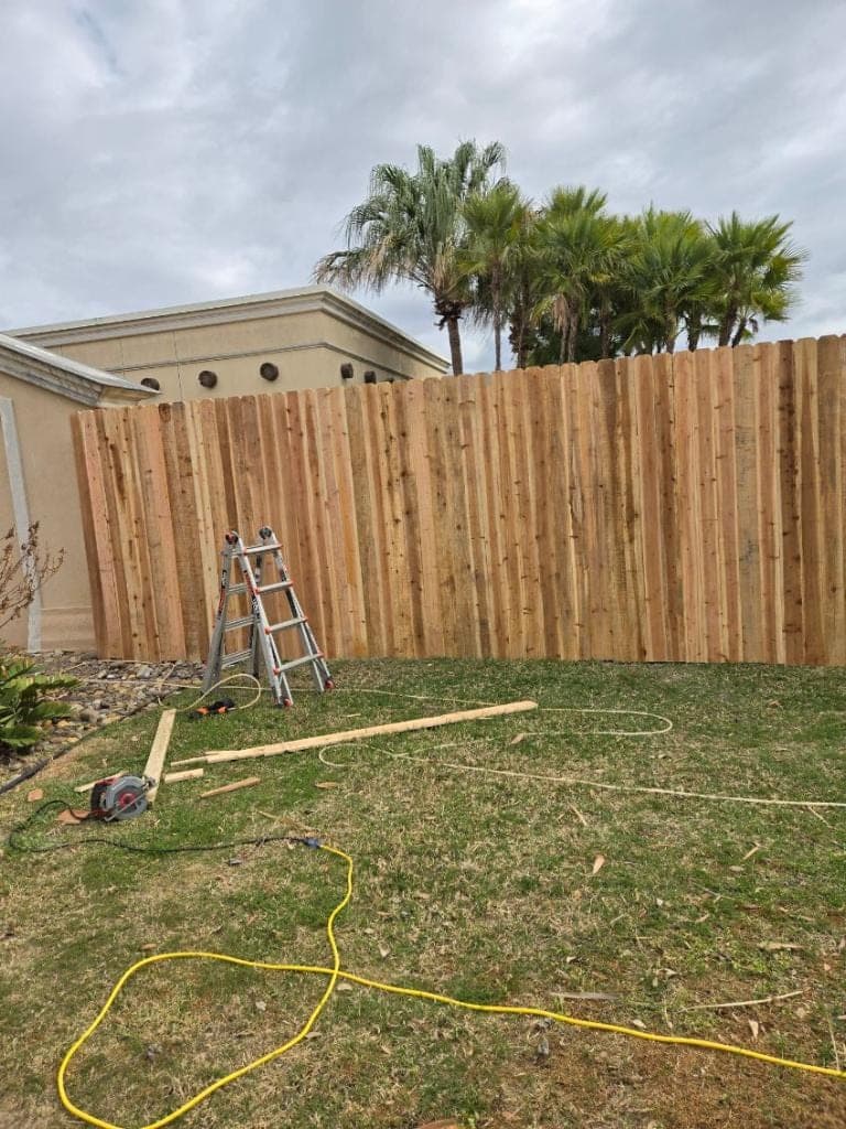 Newly installed wood and iron fence on a South Texas property