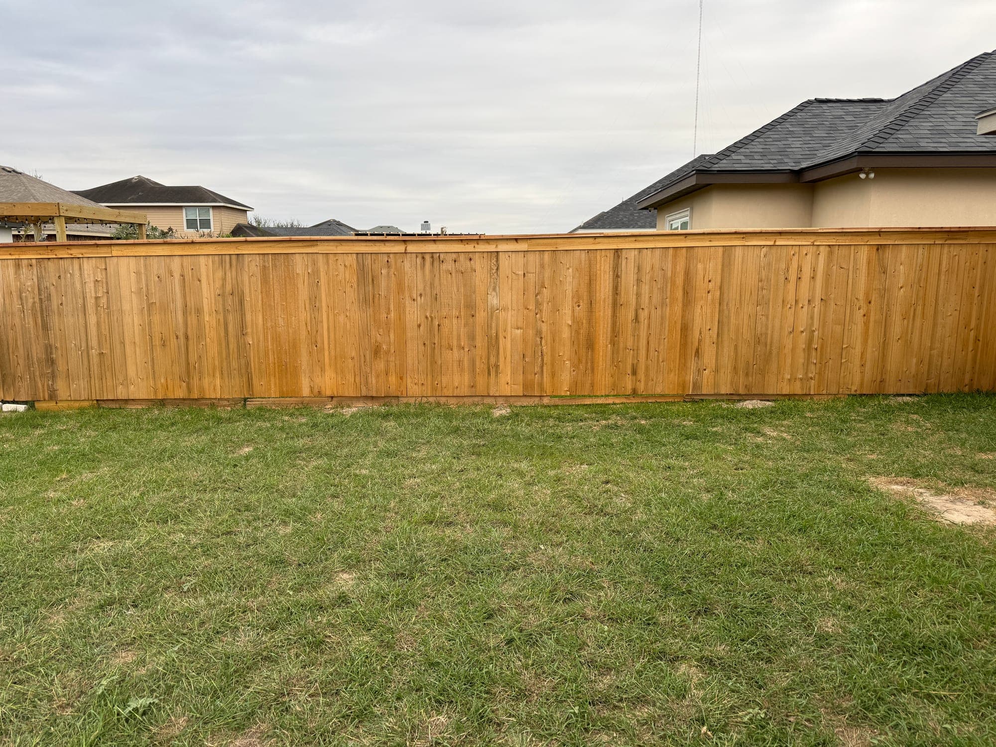 Wood privacy fence around a South Texas home